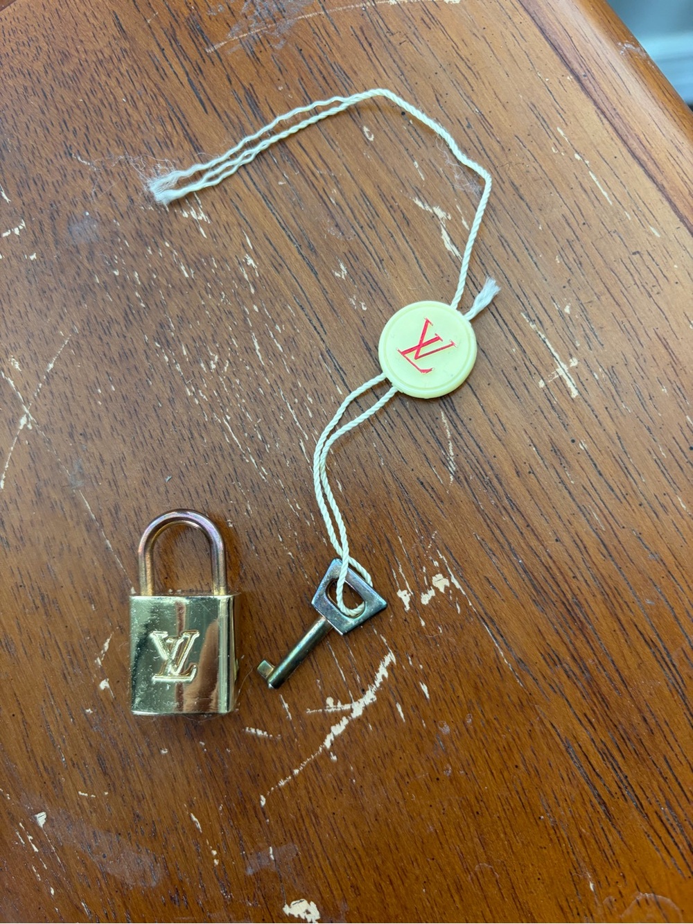 Louis Vuitton Gold Padlock and Key with LV Tag